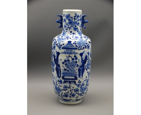 BLUE &amp; WHITE ORIENTAL FIGURAL VASE with floral background, 31cms H, Kangxi marks to the base, 19th Century