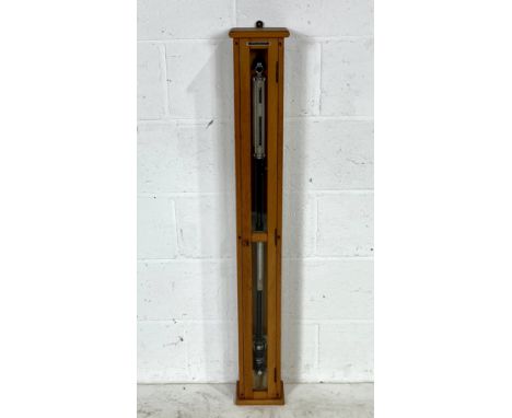 A Griffin & George stick barometer in wooden case with key.