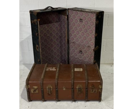 Two vintage travel trunks with labels