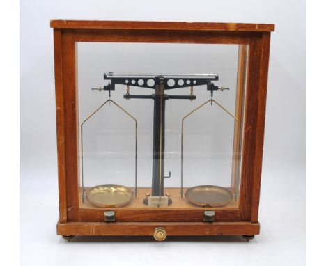 A cased set of scales, marked 'Phillip Harris Ltd, Birmingham' - length 39.5cm, depth 20.5cm, height 43cm