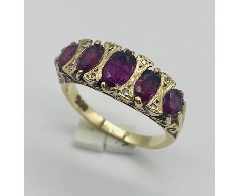 A 9ct gold ruby 5 stone ring