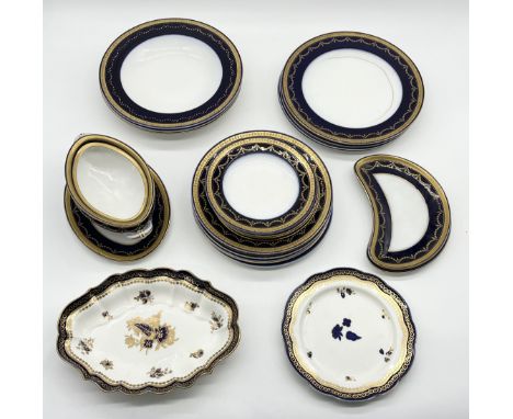 A Royal Worcester cobalt and gilt part dinner service along with two Royal Worcester scalloped plates with similar pattern