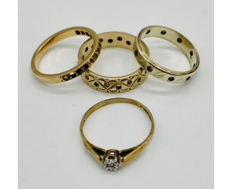 Two 9ct gold eternity rings along with a 9ct gold diamond solitaire with illusion setting and an 18ct gold eternity ring (sto