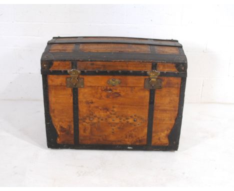 An antique metal bound dome topped trunk, with stud detailing and brass plaque with initials 'E M' - length 90.5cm, depth 53c