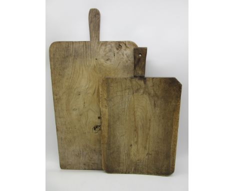 Two vintage wooden breadboards, largest 72 cm height