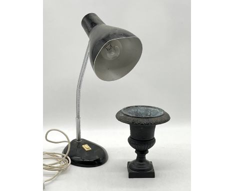 A cast iron miniature urn along with a vintage Herbert Terry anglepoise lamp. 