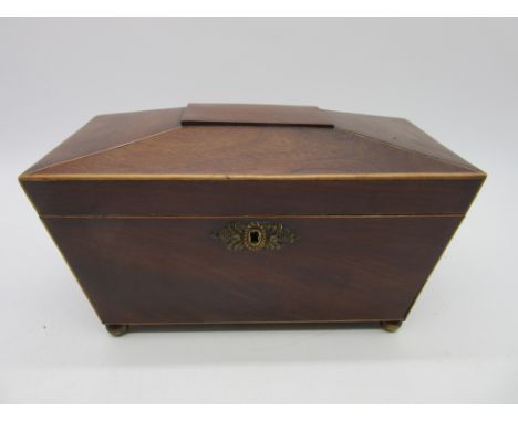 A mahogany sarcophagus shaped tea caddy with boxwood stringing 