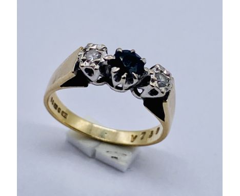 A sapphire and diamond three stone ring set in 9ct gold