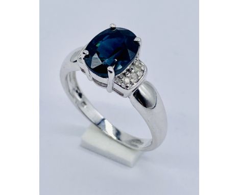 A 9ct white gold sapphire and diamond ring with COA