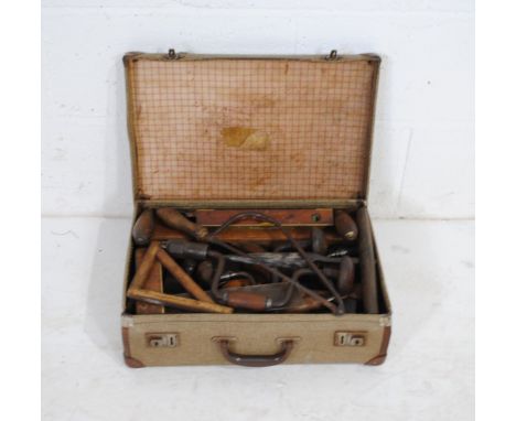 A quantity of vintage tools, including W. Marples, Stanley, Disston etc contained within a small vintage suitcase