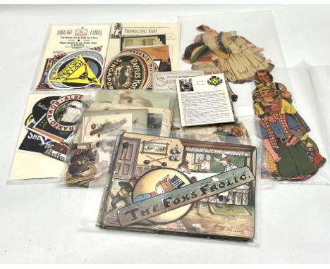 A collection of ephemera including "The Fox's Frolic", Victorian scraps, repro vintage travel labels etc 