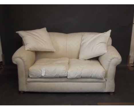 A Victorian drop end two seater sofa with hump back, on bun supports, 65" x 36" x 32"high 