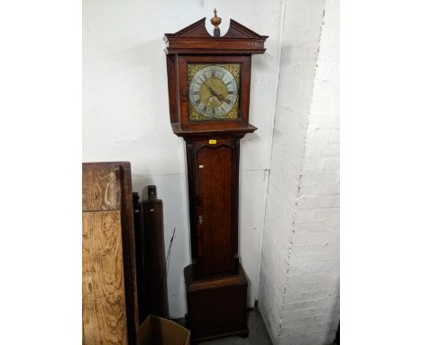 An 18th century oak longcase clock with an 8-day bell strike movement, brass dial and silvered chapter ring, inscribed John R