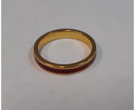 A yellow metal and enamel ringLocation: 