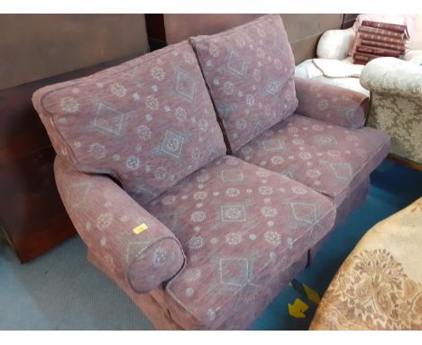 A purple two-seater sofa 