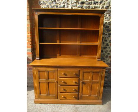 A vintage Ercol Old Colonial elm stained dresser having a plate rack above drawers and cupboard doors, 189cm h x 144cm wLocat