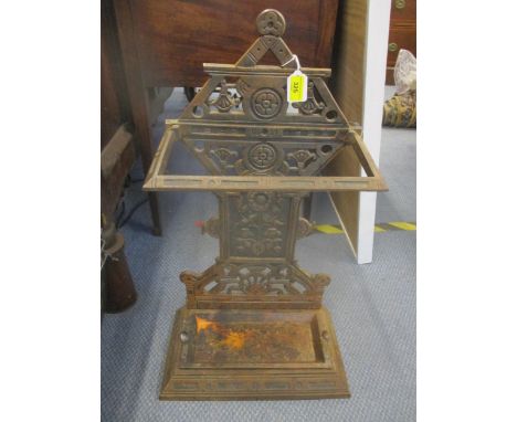 A cast iron aesthetic period style stick/umbrella stand with drip tray, both cast with Rd No 19735Location: Podium 