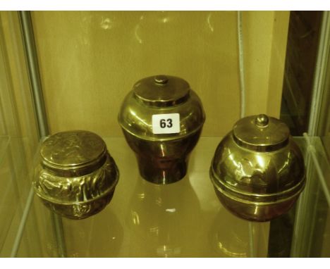 TWO BRASS LIPTONS TEA CADDIES AND BEATEN BRASS TEA CADDY
