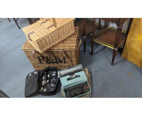 A mixed lot to include a Lettera 22 typewriter and travel case, together with a wicker picnic basket with flatware and cutler