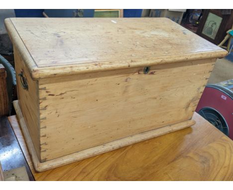 A Victorian pine twin handled trunk with brass drop handles, 40h x 74wLocation:If there is no condition report shown, please 