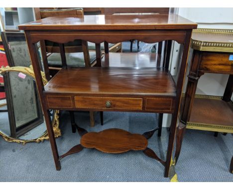 A late 19th/early 20th century mahogany and boxwood inlaid two tier table with a single drawer and a shelf underneath uniting