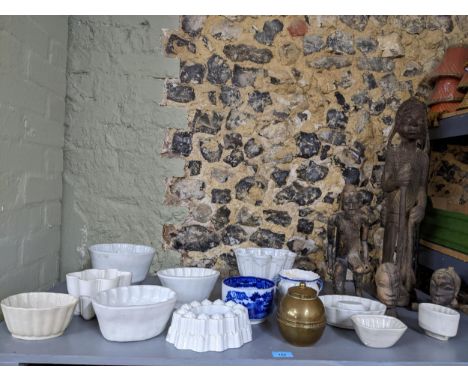 Group of carved wooden African figures, pottery jelly moulds including Shelley, and a Wembley Empire Exhibition Lipton's tea 