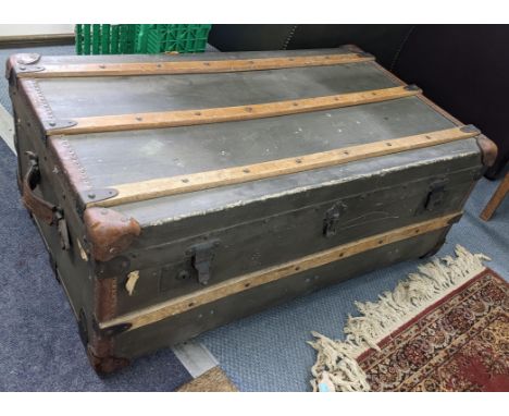 An early 20th century leather and beech banded, twin handled trunk, 37h x 93wLocation:If there is no condition report, please