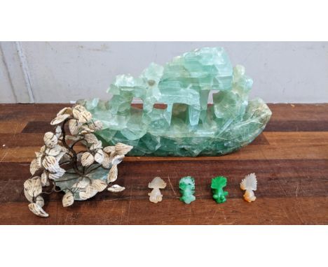 A jade coloured carved stone junk, a mother of pearl and stone model plant and model fish Location:If there is no condition r