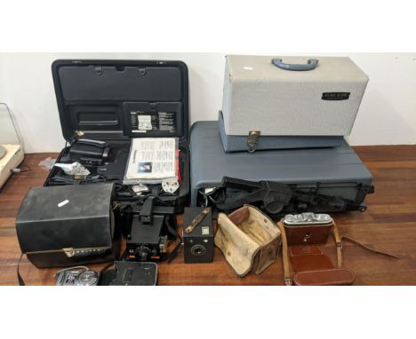 Vintage cameras and projectors to include an Agfa case, an Elmo slide projector and othersLocation:If there is no condition r