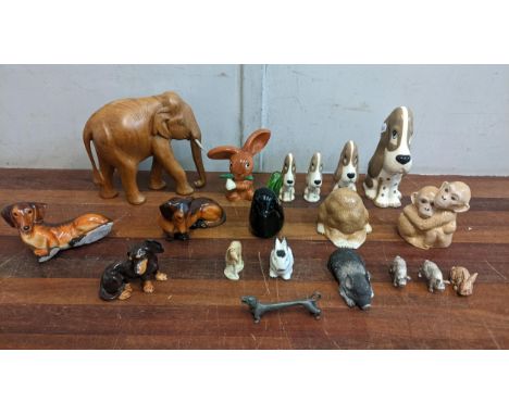 A collection of mostly ceramic miniature animals to include four Szeiler 'Sad Sam' basset hound figures, a Szeiler studio pot