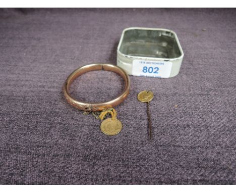 A 9ct Gold Bangle marked 9ct with an American One Dollar Gold Coin having Indian Head along with a Stick Pin with a 1851 Amer