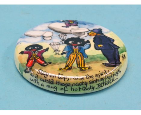 A ceramic pot-lid, comical gollys advertising Bovril by Joan Allen 