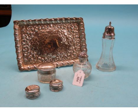 A rectangular silver dressing tray, embossed with leafage throughout, Birmingham 1911, 10.5in. and five silver-mounted glass 