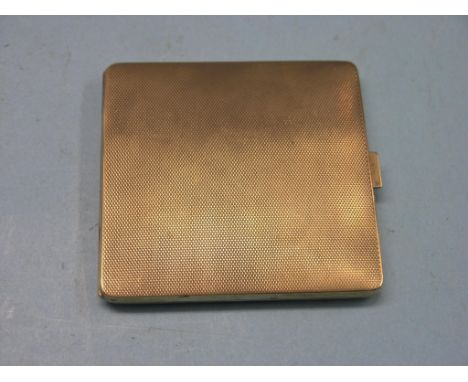 An engine-turned 9ct. gold cigarette case, Birmingham 1935, 104.4 grams 