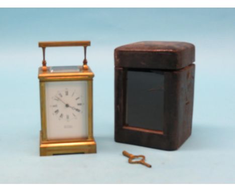 A French brass carriage clock, enamelled dial signed Spittall, Whitehaven, 8-day movement striking on a gong, with key, 7.25i