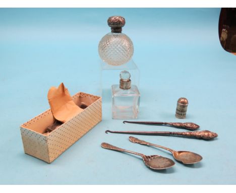 Two late 19th century American silver dollars, other coins including crowns, two silver-mounted scent bottles and two silver-