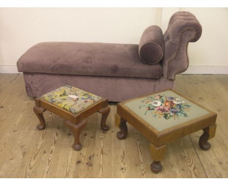A day-bed-ottoman, upholstered in a brown dralon and two oak footstools, on cabriole legs