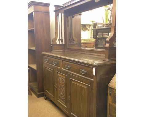 A late Victorian dark walnut sideboard, bevelled mirror back with over-shelf, panelled cupboard base with two drawers 