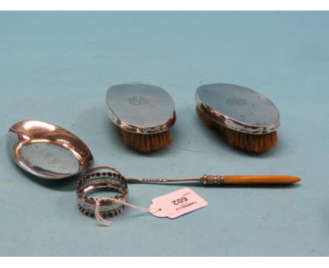 A pair of silver clothes brushes, Birmingham 1912, an oval silver dish, engraved silver napkin ring and a silver plated pickl