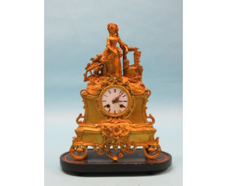 A 19th century French gilt-metal mantel clock, enamelled dial signed Foy a Paris, case mounted with a milkmaid, with key and 