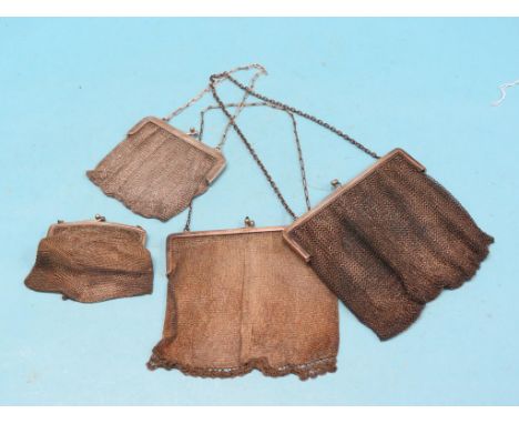 Three silver and silver mesh evening purses and an engine-turned white metal evening purse, approx. 26.5oz. total