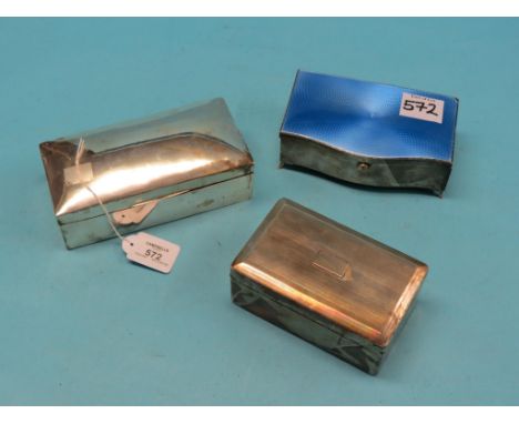 A serpentine-shaped silver cigarette box, with translucent blue-enamelled cover, Birmingham 1928, one corner enamel chipped, 