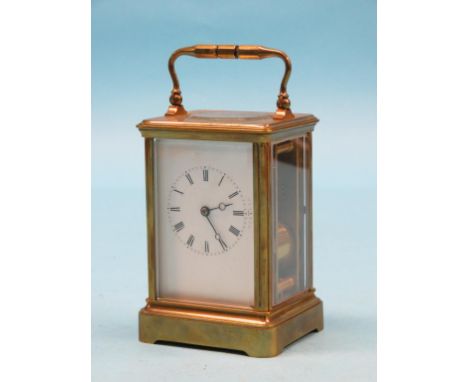 A French carriage clock, enamelled dial with moon hands, 8-day movement striking on a gong, in brass case, 6.5in.