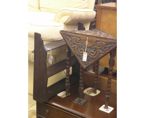 A late Victorian carved oak side table, folding top on ball-turned legs, 1ft. 3in., together with a range of three shelves, b
