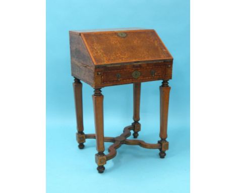 A William and Mary-period walnut and endive marquetry bureau, fall-front enclosing stepped interior with eight short drawers,
