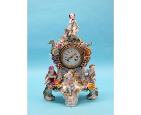 A 19th century Sitzendorf-type porcelain mantel clock, mounted with four youths emblematic of The Seasons, floral encrusted t