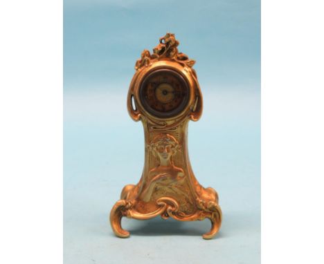 An Art Nouveau gilt-metal mantel clock, spring-driven movement, case embossed with a young female portrait bust, 10in.