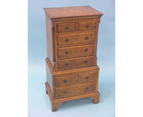 A reproduction burr walnut tallboy, four short and four long drawers, bracket feet, 1ft. 3in. wide; 2ft. 6in. high 
