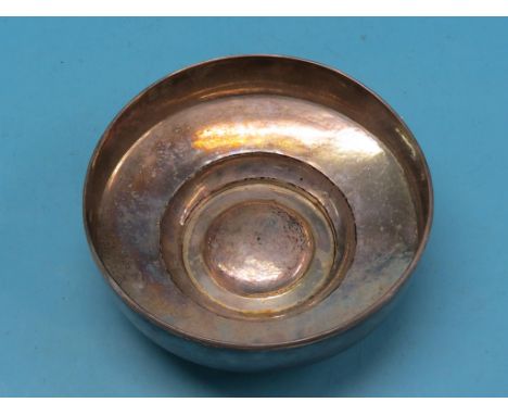 A continental hammered silver bowl, raised boss to centre, stamped 890, approx. 24.5oz., 10.5in.