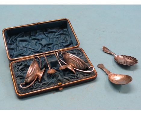 A pair of silver pedestal salts, with server spoons, in original fitted leather case, together with a Victorian engraved silv